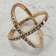 Load image into Gallery viewer, Gold ring with gemstones on a textured stone surface
